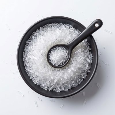 Chinese salt crystals in a bowl, showcasing their natural texture and appearance.